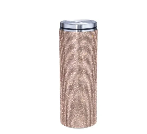 Glittery, cylindrical tumbler with a sparkling bronze surface and a silver metallic lid on a white background.