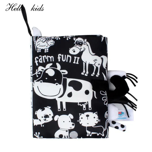 Black and white soft baby book titled "Farm Fun II" with illustrations of farm animals like a cow, horse, and sheep. The cover features a fabric texture and playful design.