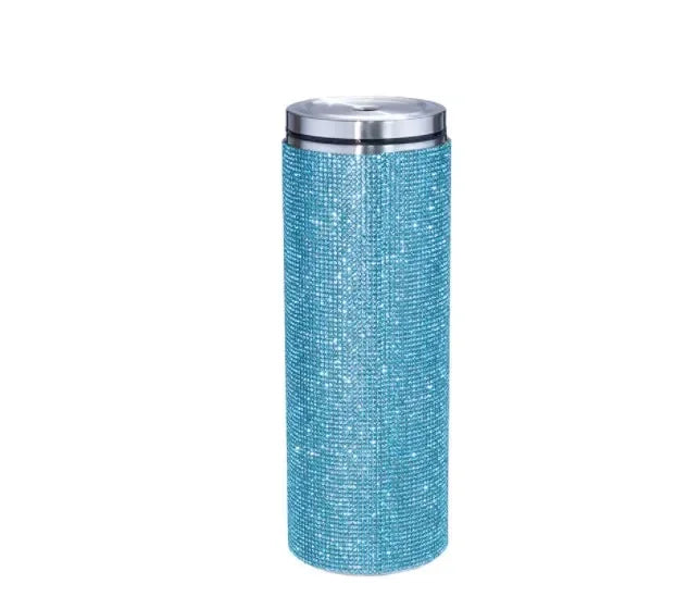 Tall cylindrical turquoise tumbler covered in sparkling rhinestones with a shiny silver lid.