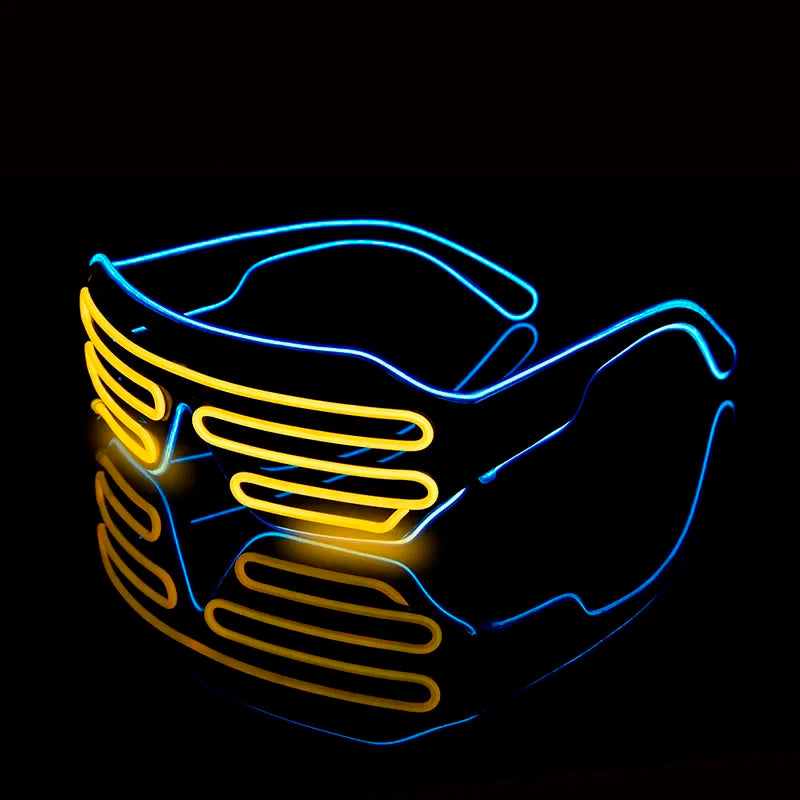 Illuminated shutter-style glasses with bright yellow and blue neon lights against a dark background, creating a vibrant, futuristic effect with reflection underneath.