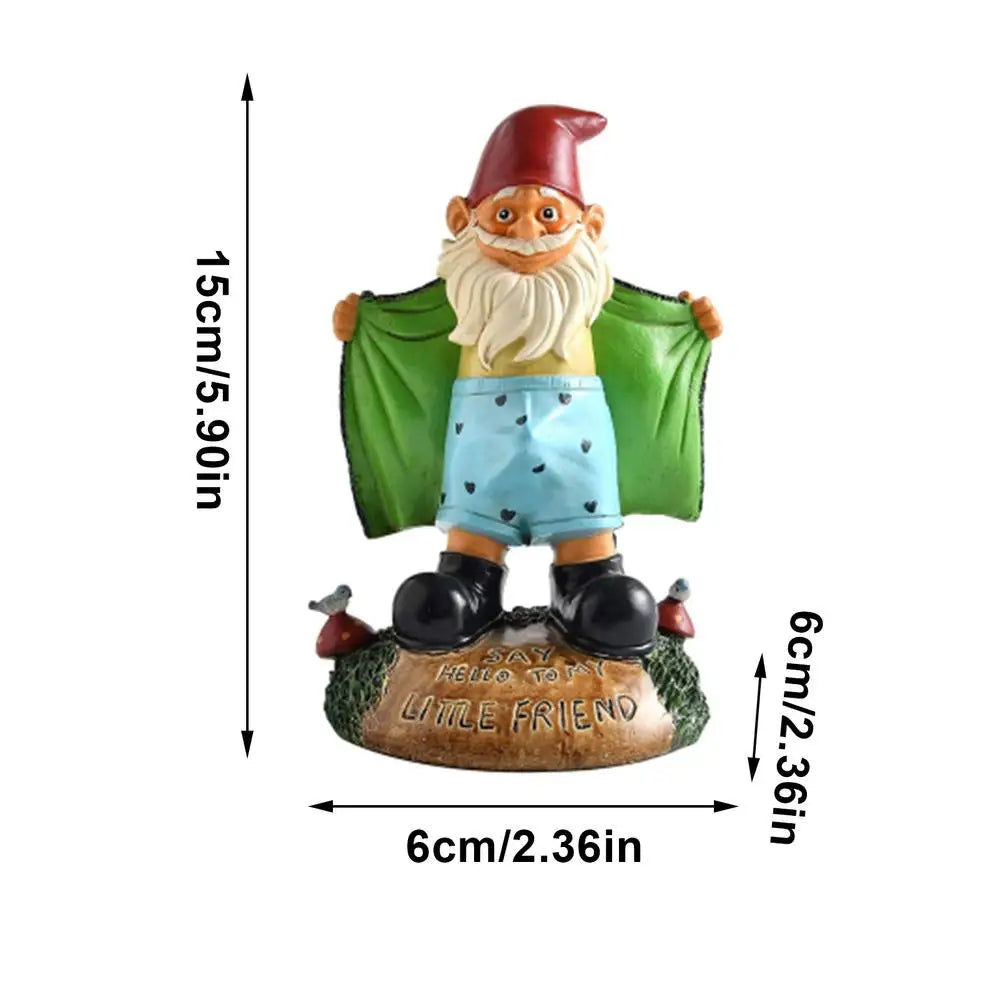 Garden gnome figurine with a red hat, beard, and blue shorts. It opens a green coat while standing on a base that reads, "Say hello to my little friend." Dimensions are shown.