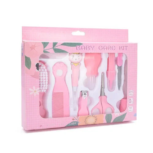 Pink baby care kit with nine grooming tools, including a comb, scissors, nail clippers, and other essentials in a floral-themed packaging, suitable for newborns.