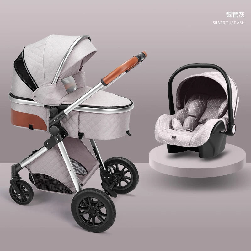 A stylish light gray baby stroller with quilted fabric, brown handle, and large wheels next to a matching car seat on a pedestal. The background is a soft gray tone.