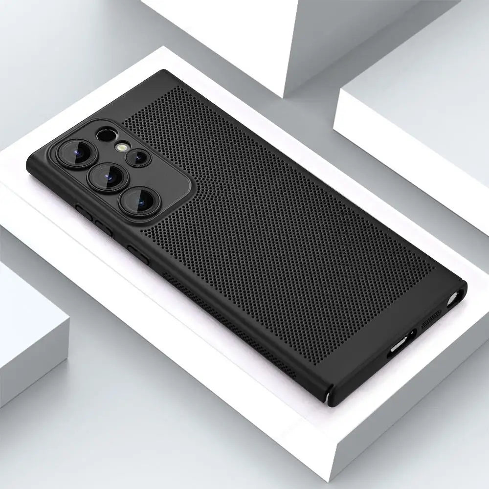 Black smartphone with three lenses and a textured, perforated case lies on a white geometric surface. The phone's buttons and ports are visible, emphasizing the sleek design.