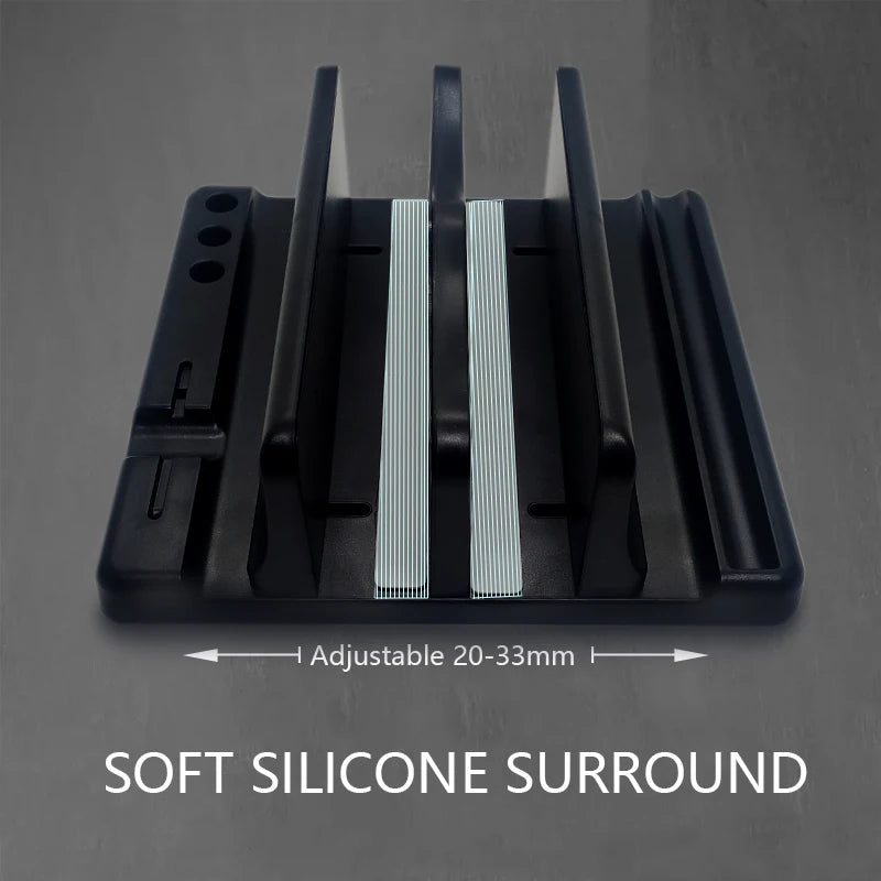Adjustable laptop stand with soft silicone surround, featuring three vertical slots for devices. Width range is 20-33mm. Suitable for organizing multiple gadgets.