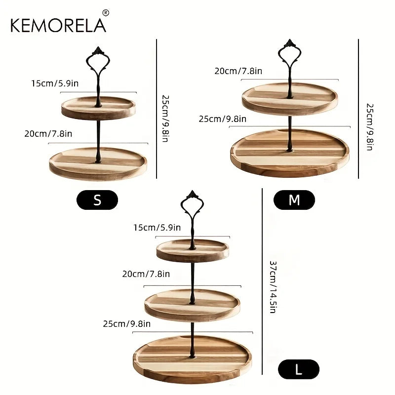 Three wooden tiered trays with dimensions. Size S has two tiers, M has two larger tiers, and L has three tiers. Each tray features a black handle. Brand: Kemorela.