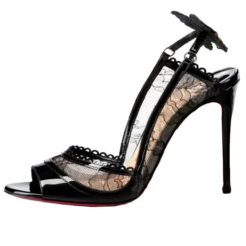 Black stiletto heel with lace sides, peep-toe design, and butterfly detail on ankle strap. The shoe features a glossy finish and red sole.