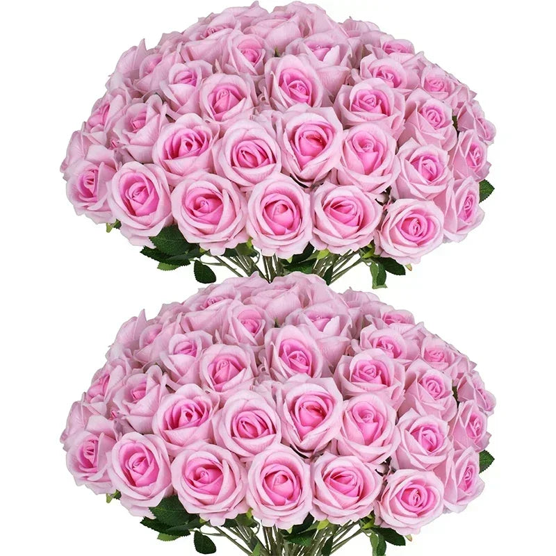 A pair of lush pink rose bouquets with vibrant green leaves, each tightly packed and symmetrically arranged, showcasing delicate, soft pink petals in full bloom.