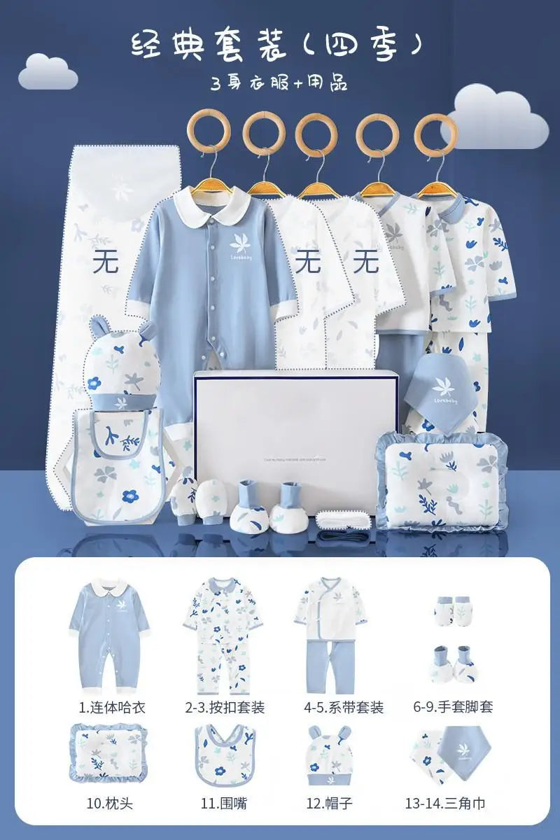 Blue and white baby clothing set displayed with hangers includes onesies, bib, gloves, socks, hat, and a pillow. Illustrated with floral and animal designs.