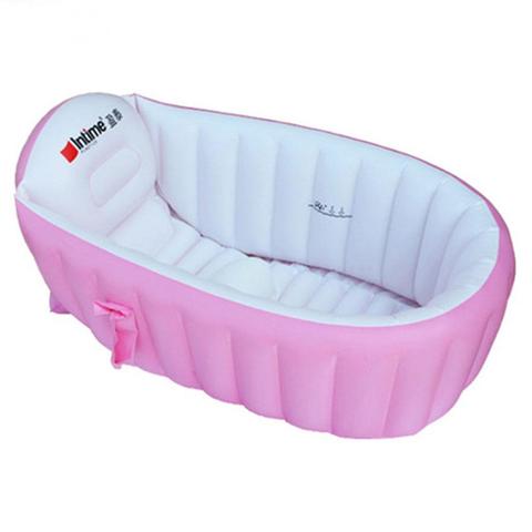 Pink and white inflatable baby bathtub with ribbed sides and an ergonomic headrest. The outer surface is pink, while the interior and base are white.
