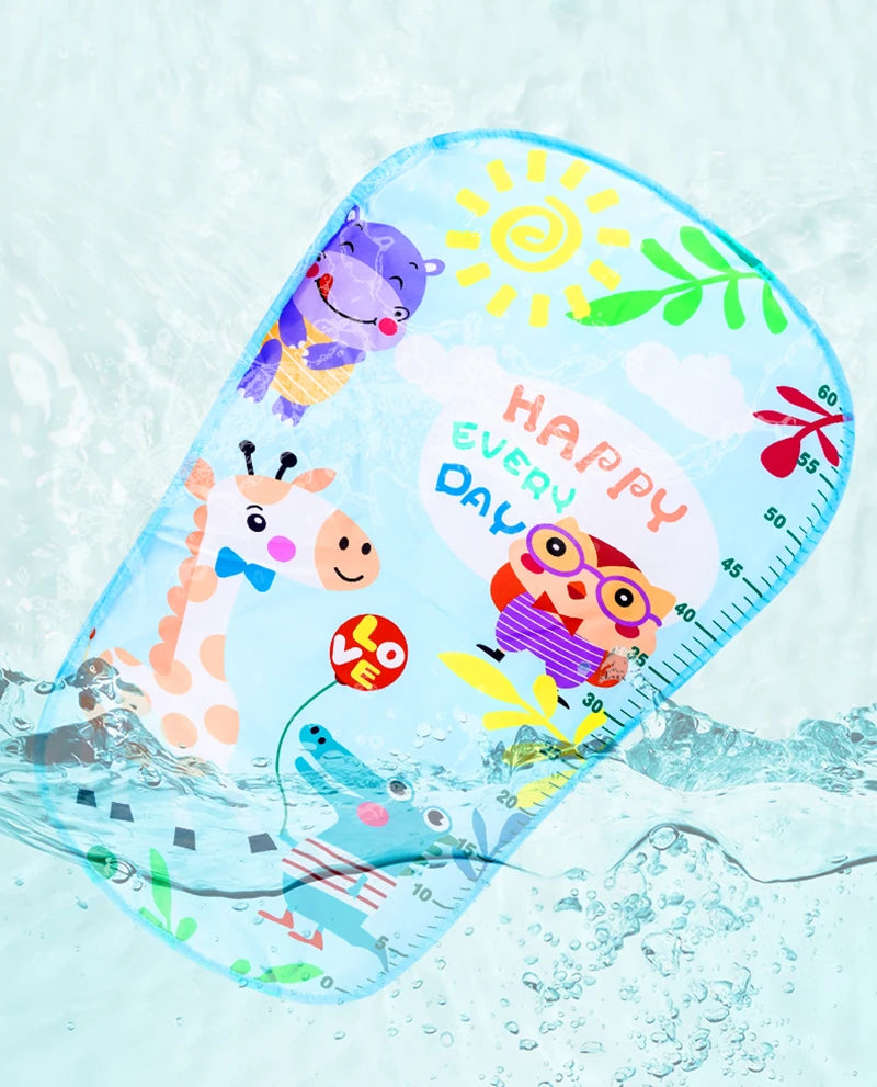 Colorful floating children's bath mat with playful animal illustrations, including a giraffe and hippo, and text "Happy Every Day" on a blue water surface.