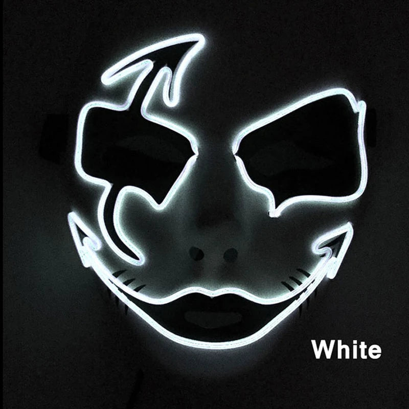 Glowing white mask with sinister smiling face, featuring bold outlines and sharp shapes around eyes and mouth, set against a dark background. Text in corner reads "White".