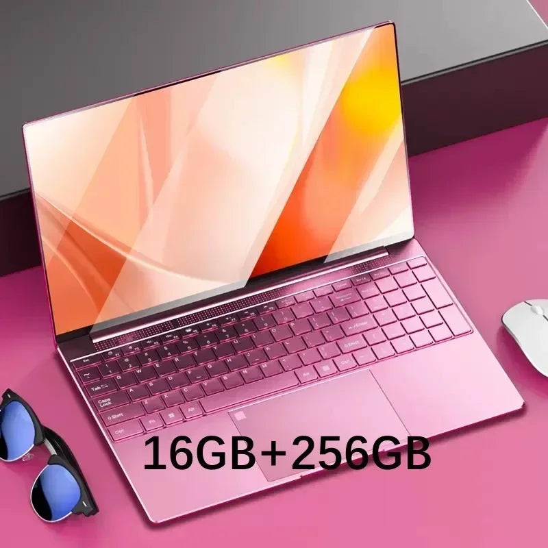 Pink laptop with a sleek design on a pink surface. The screen displays an abstract orange pattern. Sunglasses and a white mouse are beside it. Text reads "16GB+256GB."