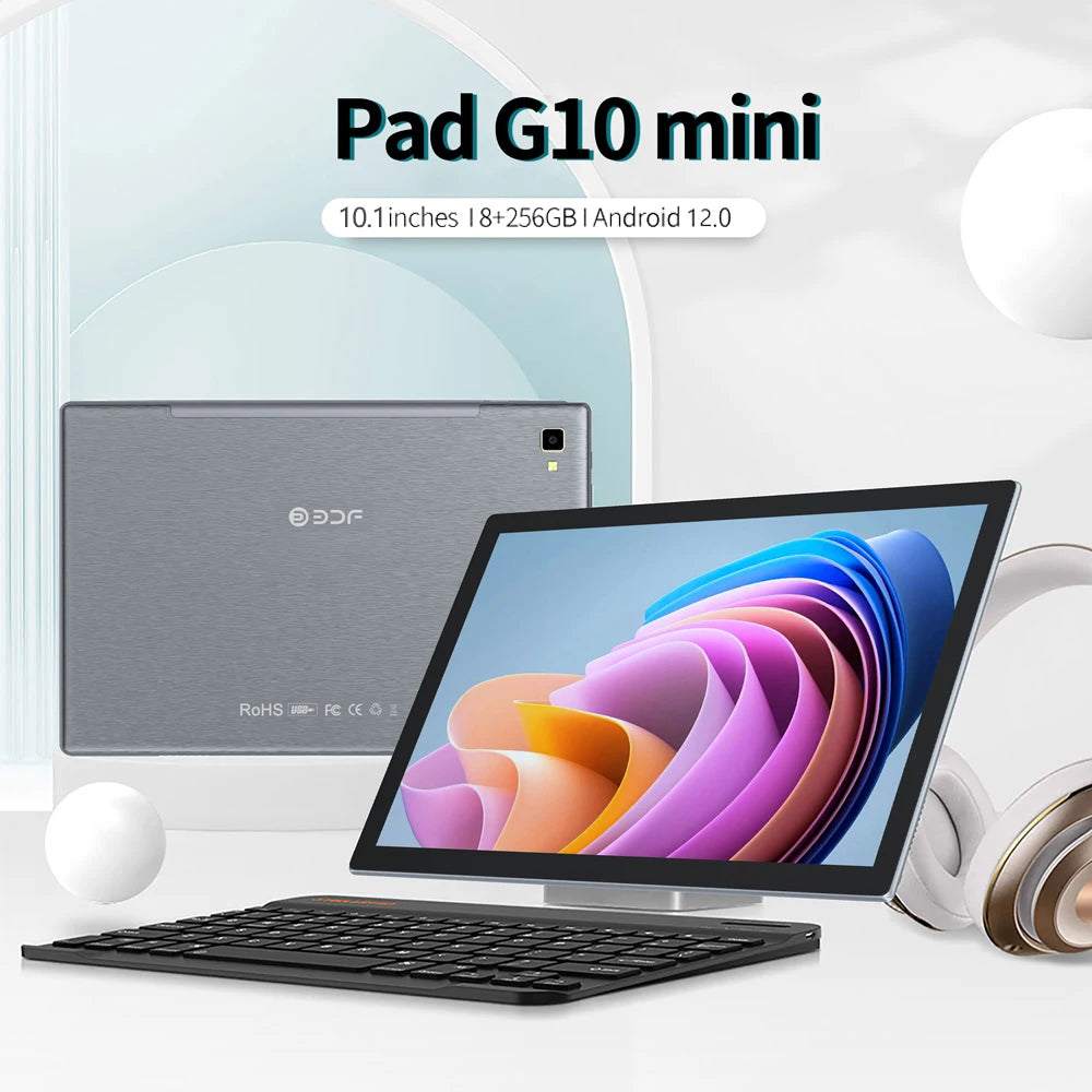 Tablet with a colorful screen, keyboard, and headphones. The text reads “Pad G10 mini, 10.1 inches, 8+256GB, Android 12.0.” A sleek tablet back is also visible.