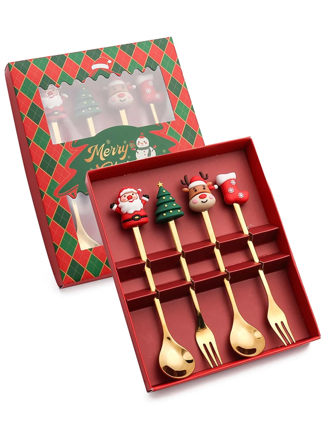 A gift box containing four gold-tone utensils with festive handles: Santa, Christmas tree, reindeer, and stocking. The box has a red and green plaid design with "Merry Christmas."