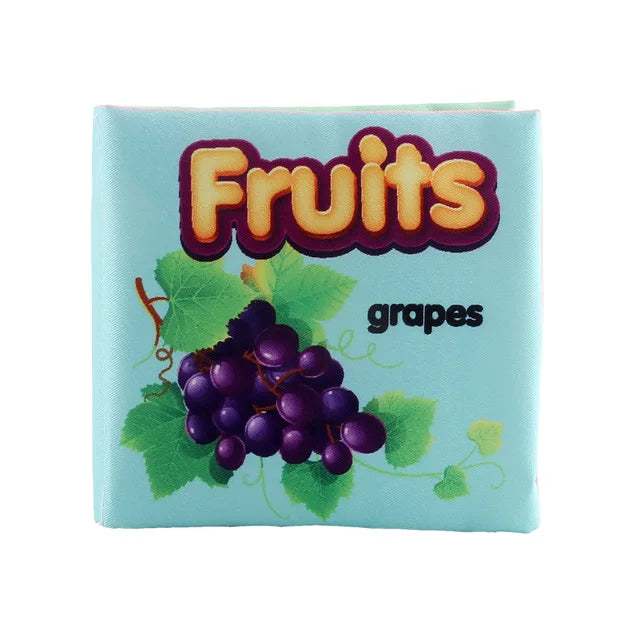 Children's book cover with "Fruits" in bold letters and "grapes" below. Features a cluster of purple grapes with green leaves on a light blue background.