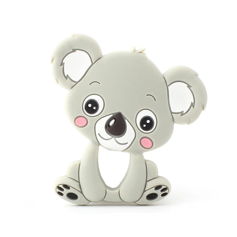 A cute cartoon koala with large eyes, pink cheeks, and soft grey fur, sitting with its legs extended. Its ears are round and fluffy, giving it an adorable appearance.