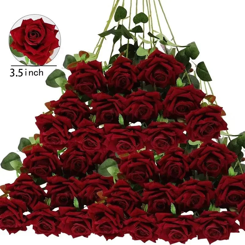A bouquet of deep red roses with greenery, arranged in a triangle shape. Each bloom is 3.5 inches wide, shown against a plain white background.