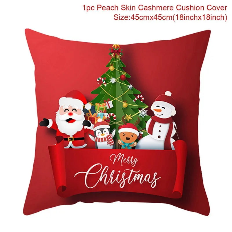 Red cushion cover featuring a festive design with Santa, a snowman, a penguin, and a reindeer by a Christmas tree, with "Merry Christmas" written in elegant font.