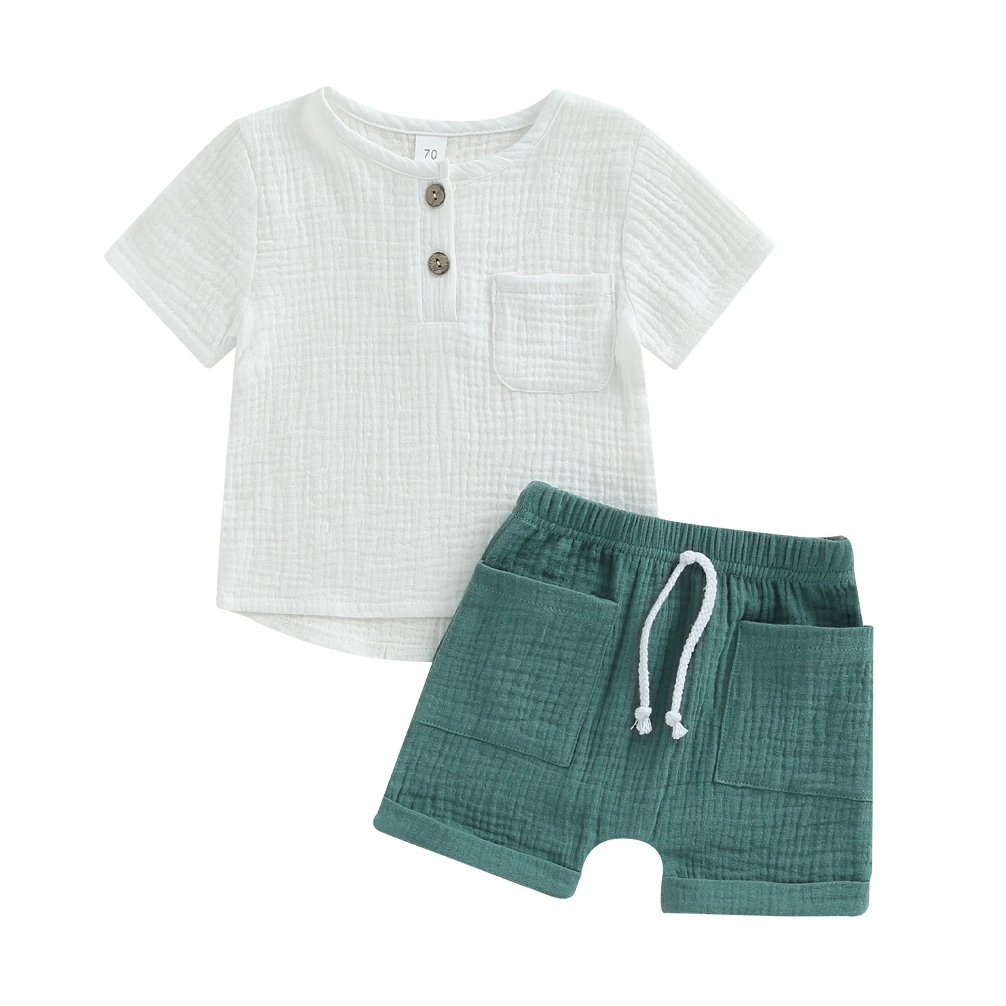 White textured short-sleeve shirt with buttons and a pocket, paired with green elastic waist shorts featuring a drawstring and front pockets, laid flat on a white background.