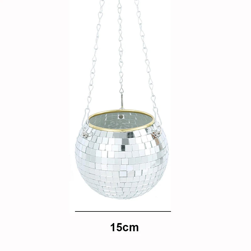 Hanging disco ball-shaped planter with a reflective mirrored surface, suspended by chains. Diameter measures 15cm.