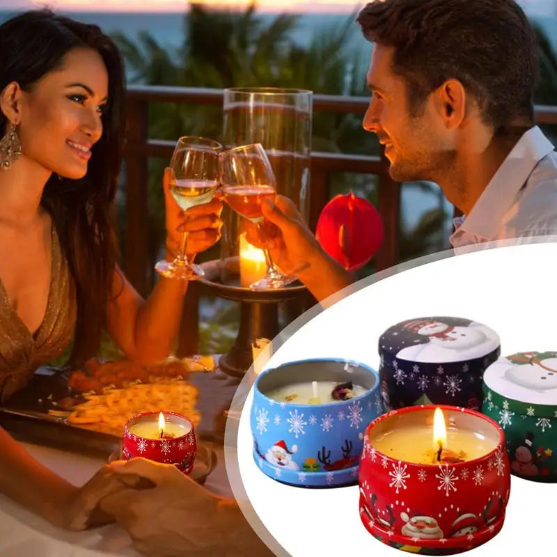 A couple enjoys a romantic dinner on a balcony, clinking wine glasses by candlelight. Inset shows colorful holiday-themed candles decorated with snowflakes and festive characters.