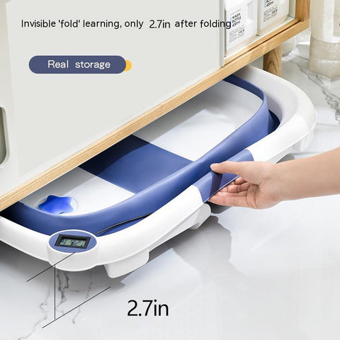 Collapsible white and blue tub stored under a shelf, showing a hand folding it to a height of 2.7 inches. Includes a digital display and text about real storage and folding capability.