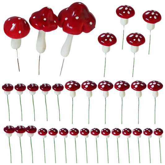 Red and white decorative mushroom figurines with polka dots, varying in size, arranged in rows. Each has a slender stem, resembling classic toadstool mushrooms.