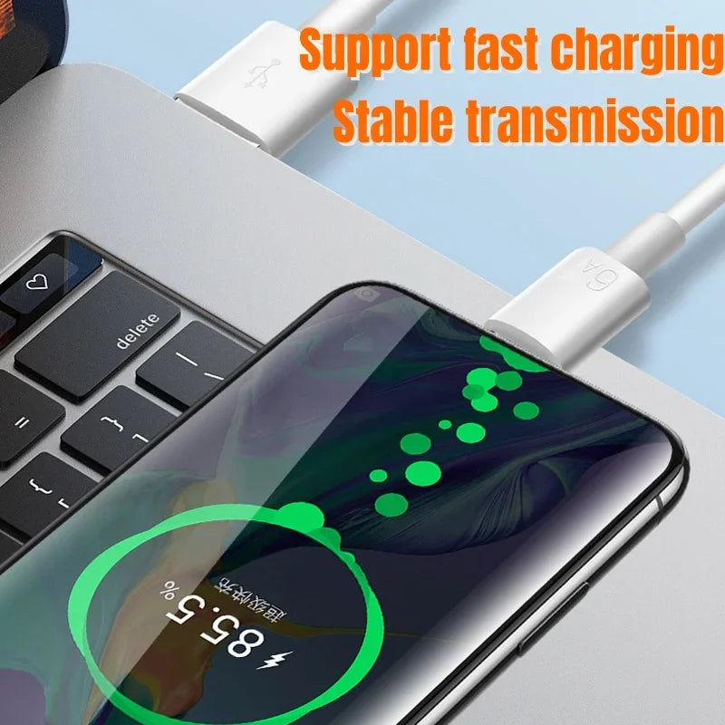 Smartphone connected to a laptop via USB cable, displaying a charging screen at 85%. Text above reads, "Support fast charging. Stable transmission."
