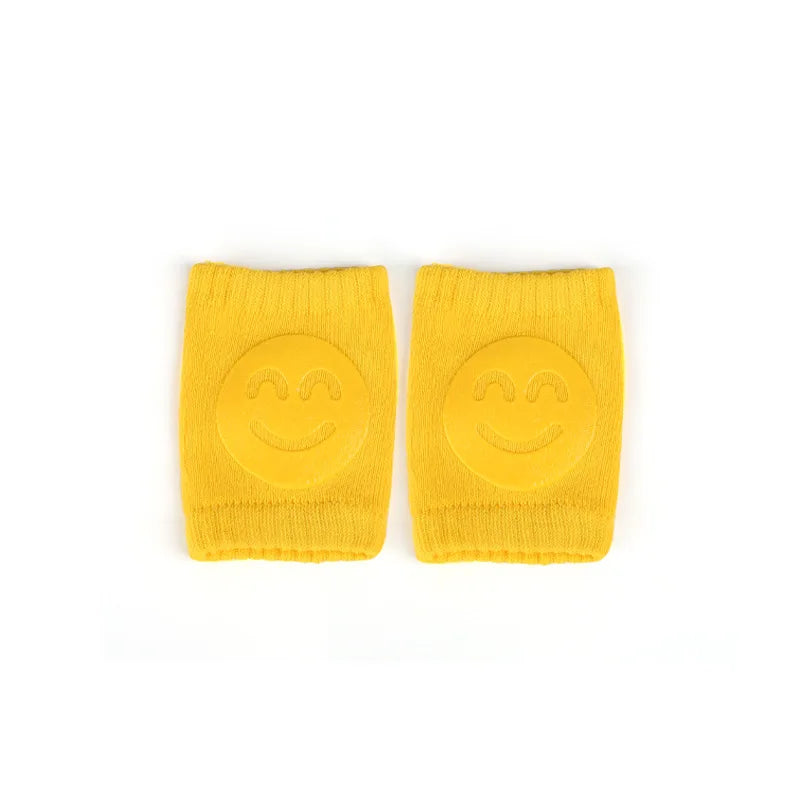 Two yellow wristbands with cheerful smiley faces on a white background, designed to bring a playful touch to any workout or casual outfit.