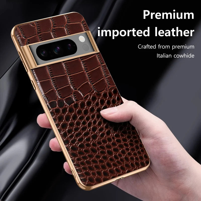 A smartphone with a crocodile-patterned leather case, held by a hand. The case features premium Italian cowhide and a metallic finish around the camera. Text reads: "Premium imported leather."