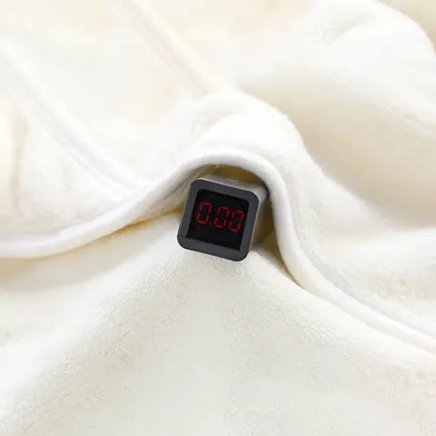 A small digital display showing "0.00" is embedded in a soft, cream-colored fabric.