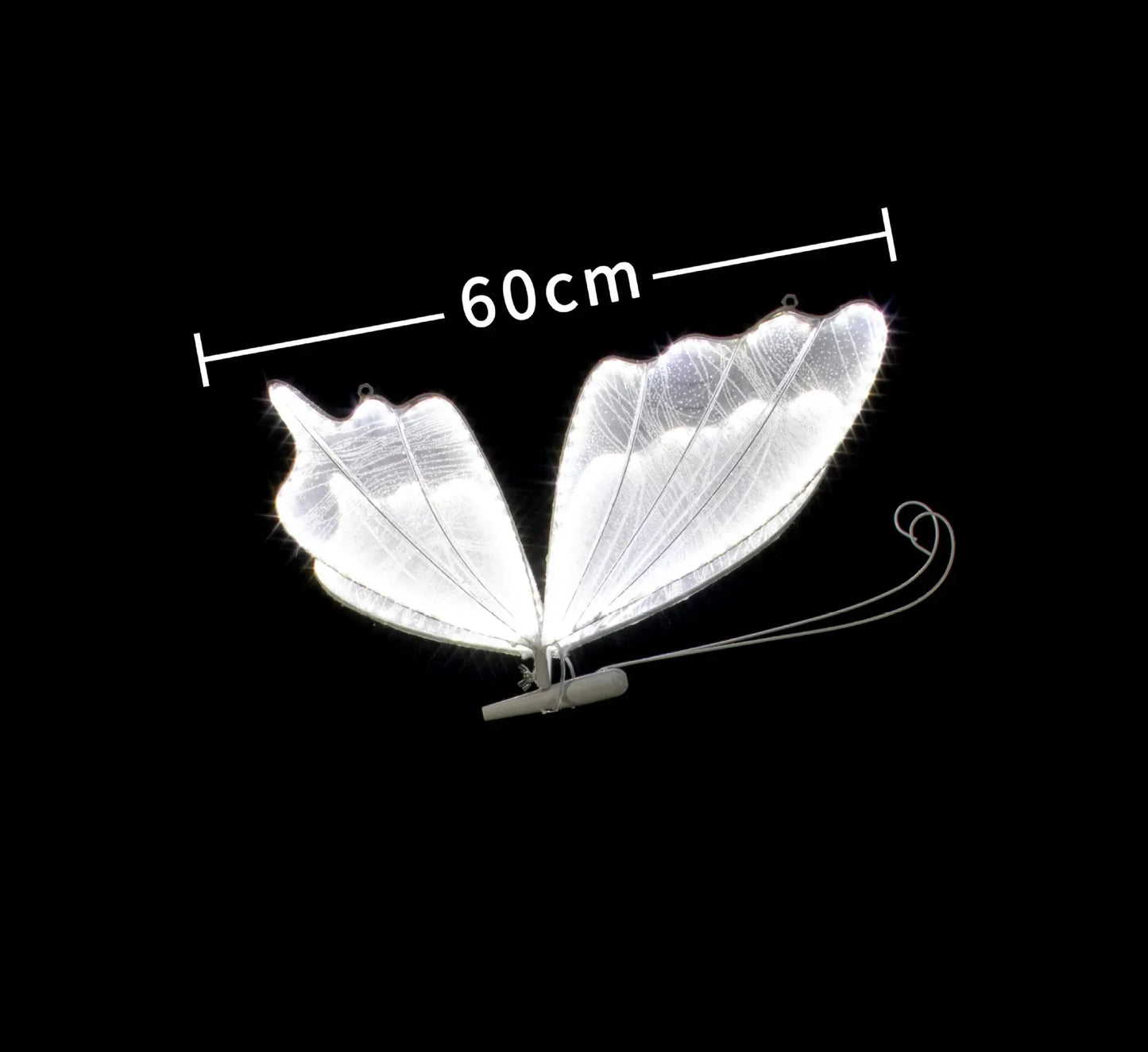 Illuminated butterfly wings measuring 60cm wide, glowing against a black background. The wings are white with visible veins and a support structure at the base.