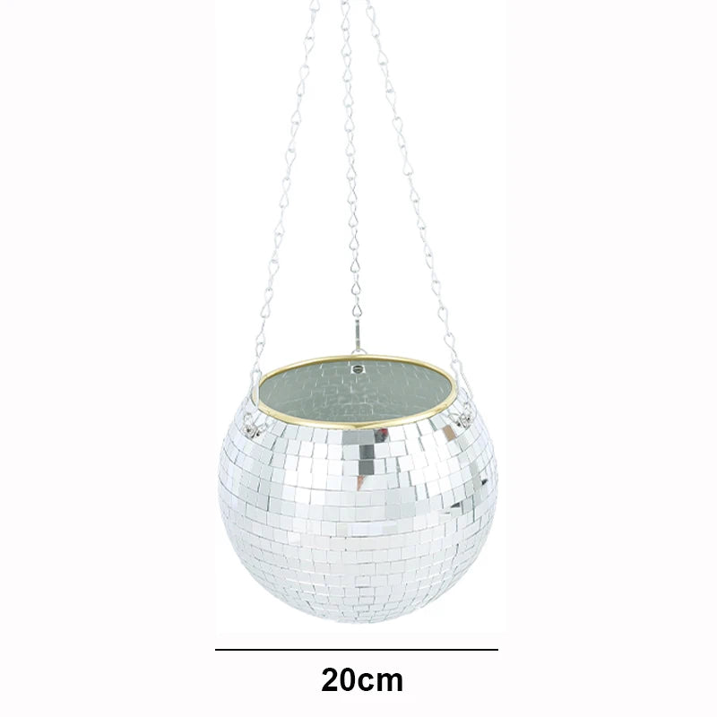 Hanging 20cm disco ball planter with mirrored tiles and a gold rim. Suspended by three silver chains, reflecting light. Ideal for plants or decorative use.