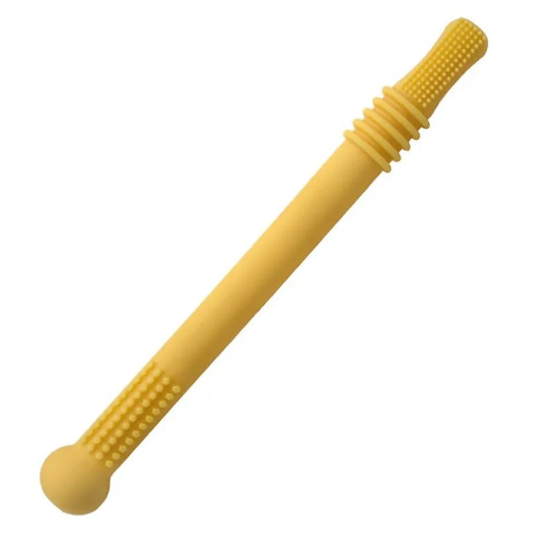Yellow silicone toothbrush stick with textured ends, one end rounded with a slightly bulbous tip, and the other with a tapered ribbed design for baby oral care or sensory use.