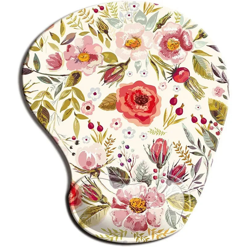 Floral mouse pad with pink and red flowers, green leaves, and berry accents on a cream background, shaped ergonomically for comfortable wrist support.