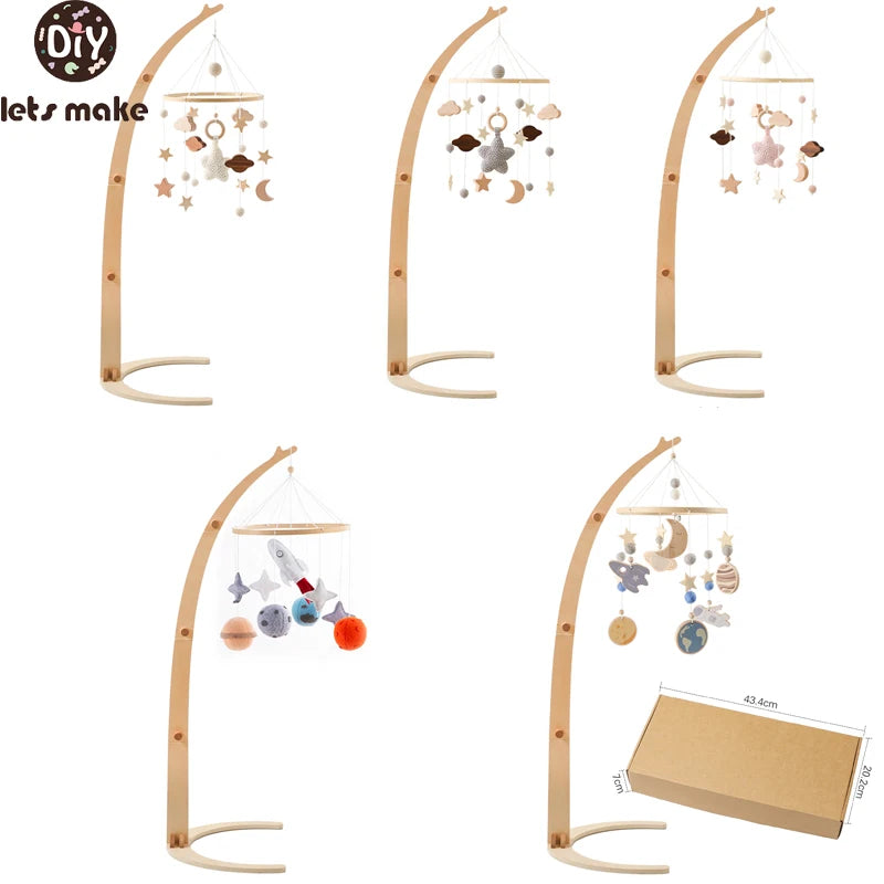 Five wooden baby crib mobile stands with various hanging designs, including stars, moons, clouds, and planets. Packaging box dimensions shown are 43.4cm x 20.2cm x 7cm.