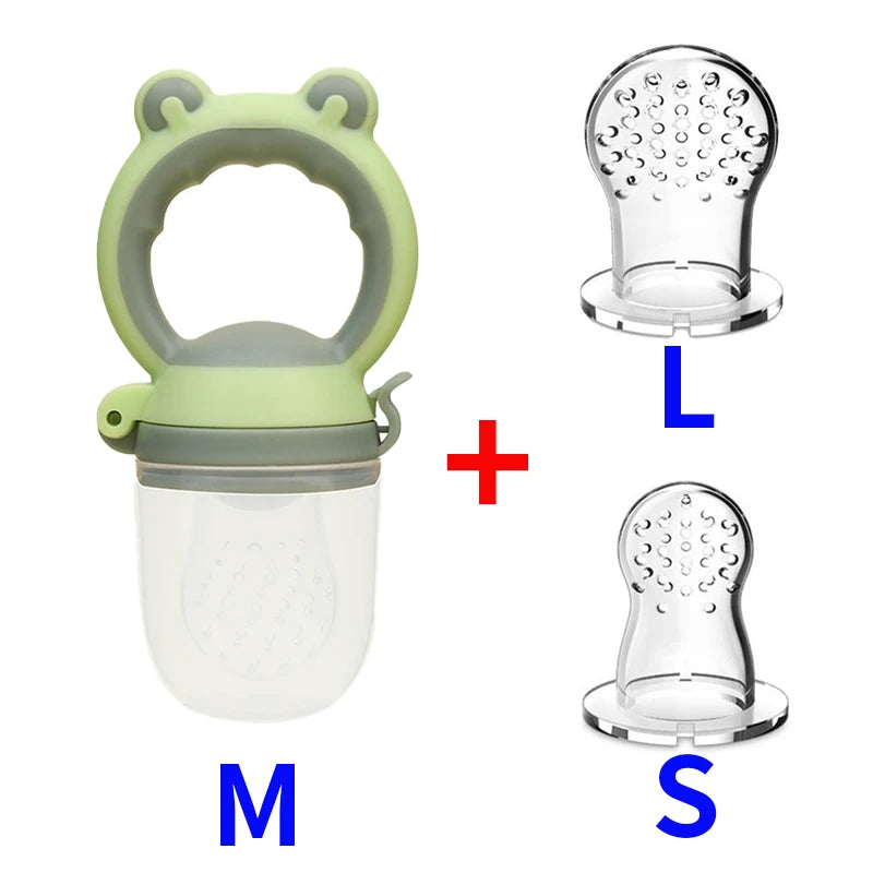 Green silicone baby feeder with handle and attached cap. Includes two clear interchangeable teats, labeled L and S, with a red plus sign between items.