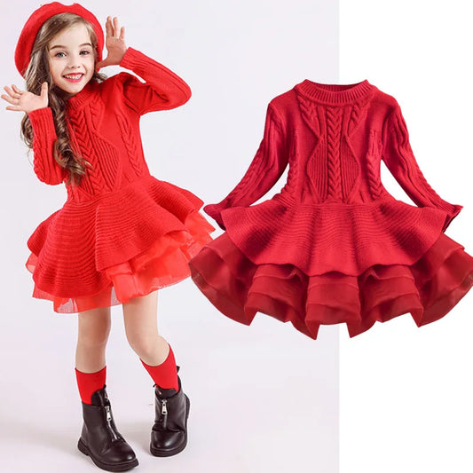 A smiling girl poses in a vibrant red knit dress with layered ruffles, matching beret, red socks, and black boots. The dress is displayed separately on the right.