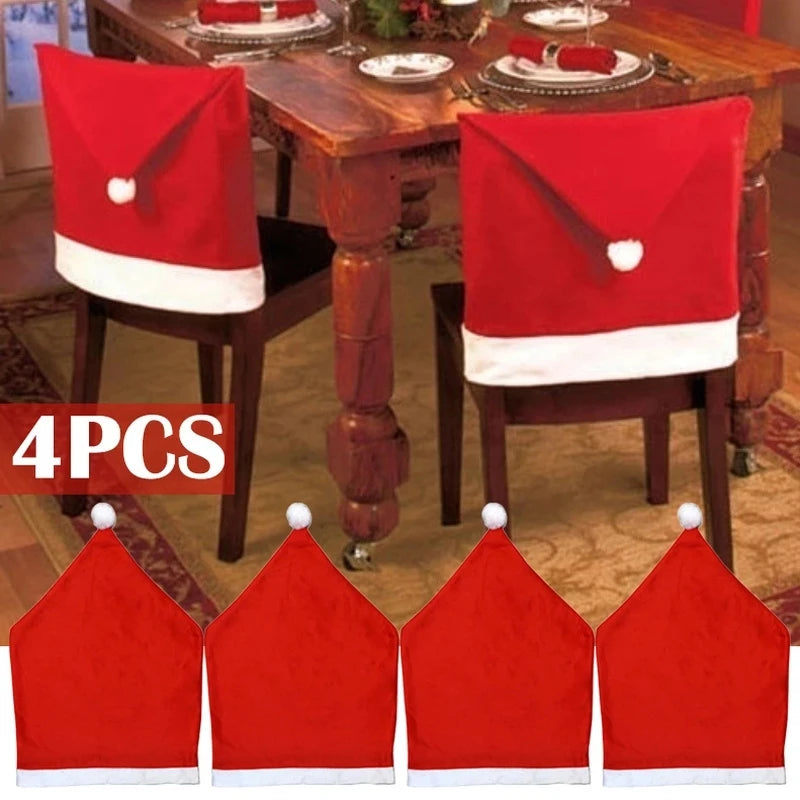 Four red and white Santa hat chair covers decorate a dining room set, with a festive table setting featuring plates, utensils, and napkins in a cozy, holiday-themed room.