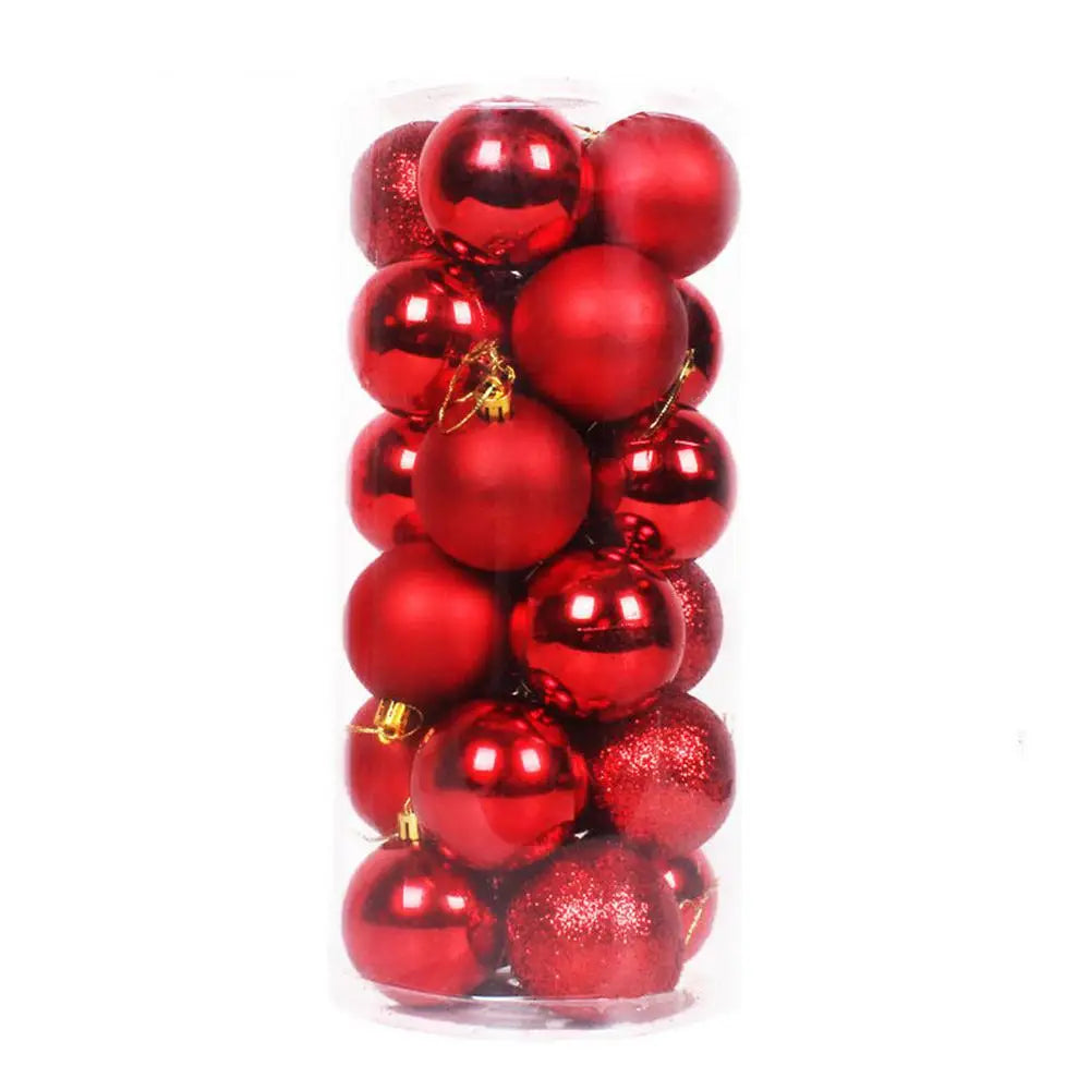 A transparent plastic container filled with shiny and matte red Christmas ornaments, including both smooth and glittery textured baubles.