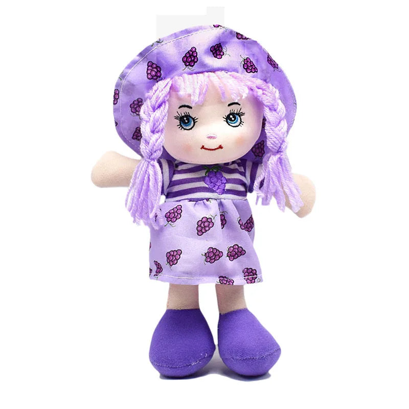 Plush doll wearing a purple dress, hat, and shoes adorned with grape patterns, featuring lavender yarn hair and a smiling face with blue eyes.