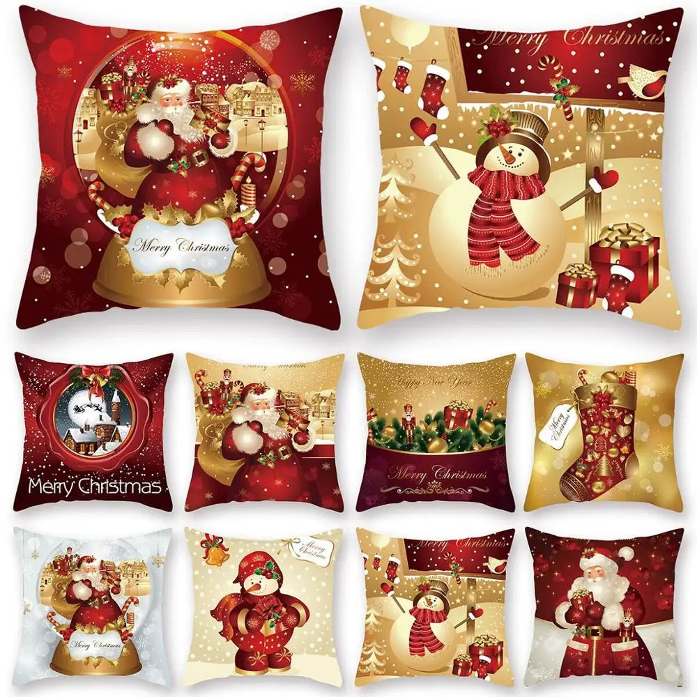 A collection of festive Christmas-themed pillows featuring Santa Claus, snowmen, stockings, and gifts on red and gold backgrounds with holiday greetings.