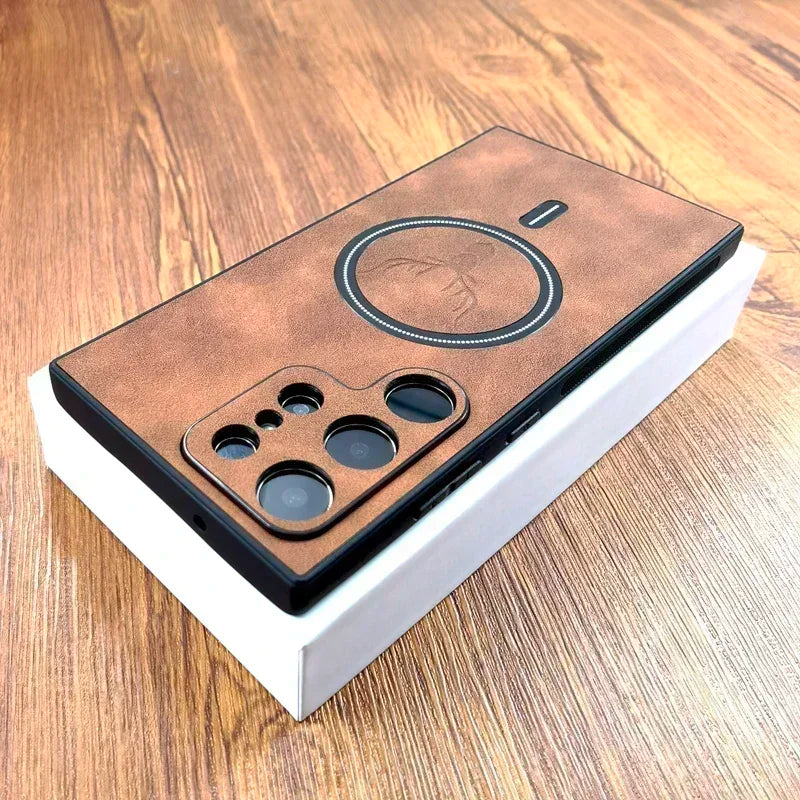 Smartphone on a wooden surface features a brown leather back with multiple camera lenses and distinct circular design, resting on a white box.