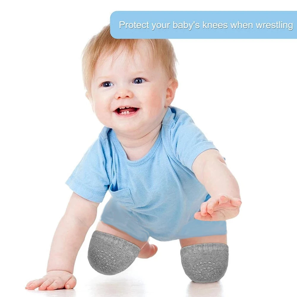 A smiling baby in a blue shirt crawls on all fours, wearing gray knee pads. A blue caption above reads, "Protect your baby's knees when wrestling."