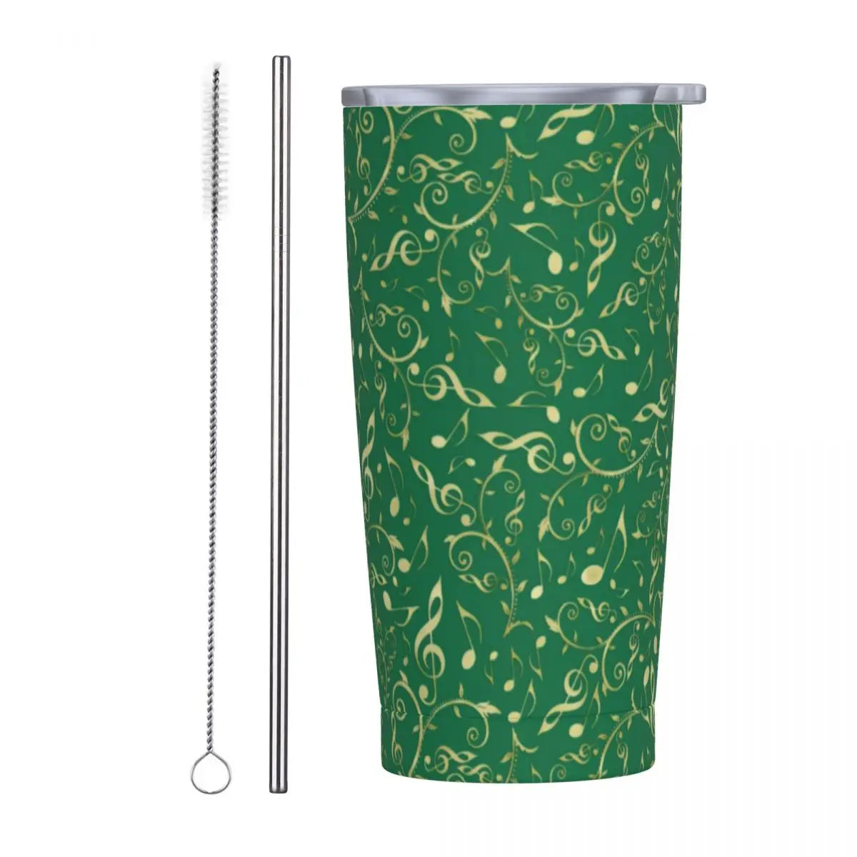 Green tumbler with golden musical notes and swirls pattern, beside a silver metal straw and cleaning brush, set against a plain white background.