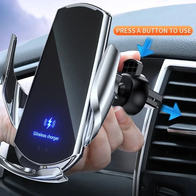 A hand installs a sleek, silver wireless phone charger in a car's air vent. The charger features a glowing blue icon and text, with an arrow indicating the button to press.