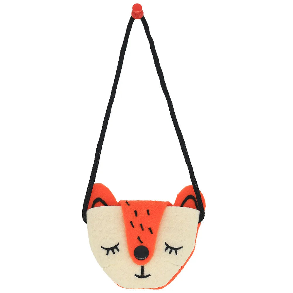 Cute fox-shaped felt bag with a black strap. The bag features embroidered sleeping eyes, a black nose, and orange and cream colors, resembling a fox's face.