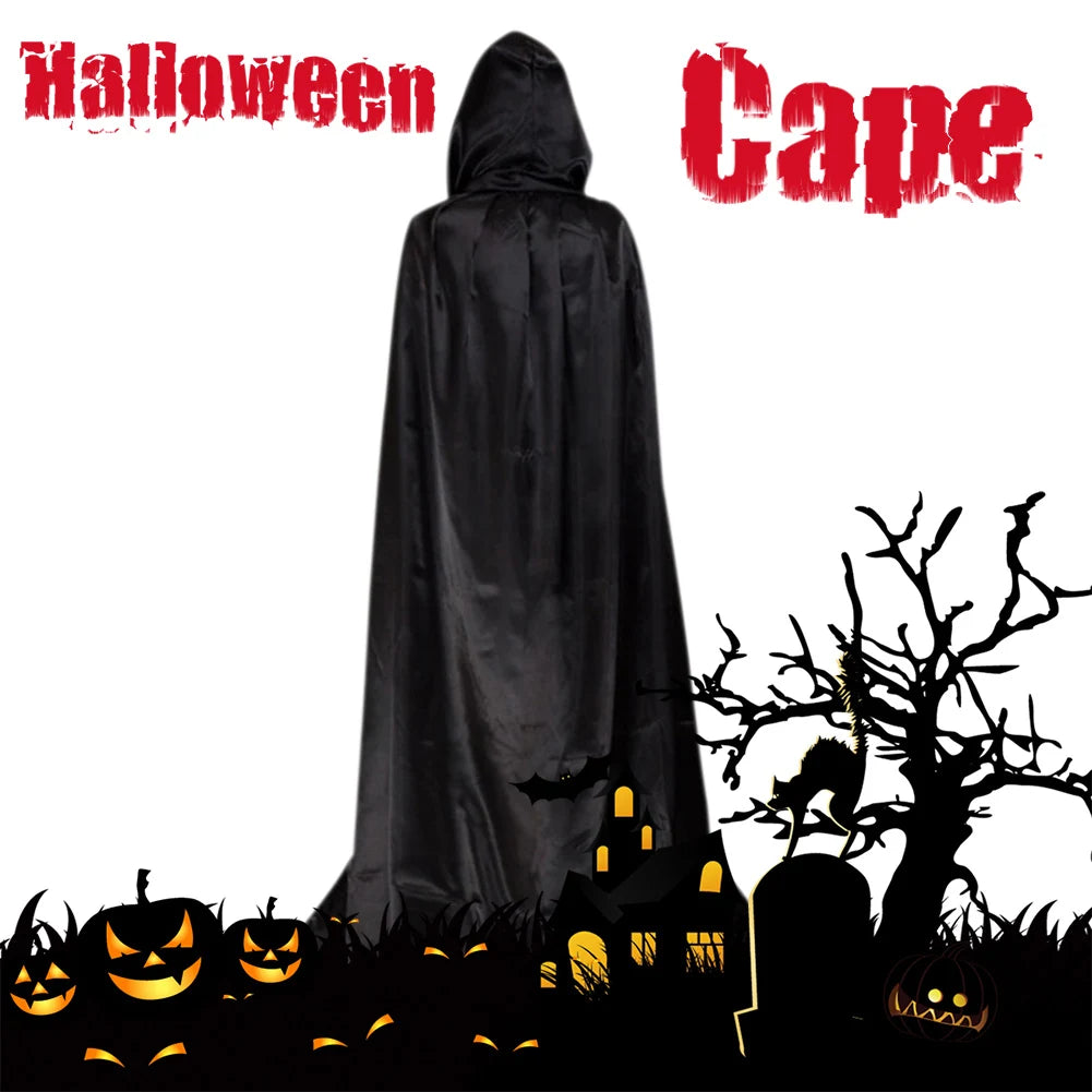 Black hooded Halloween cape on a figure with a spooky background of jack-o'-lanterns, bats, bare trees, and haunted house silhouettes. Red text reads "Halloween Cape."