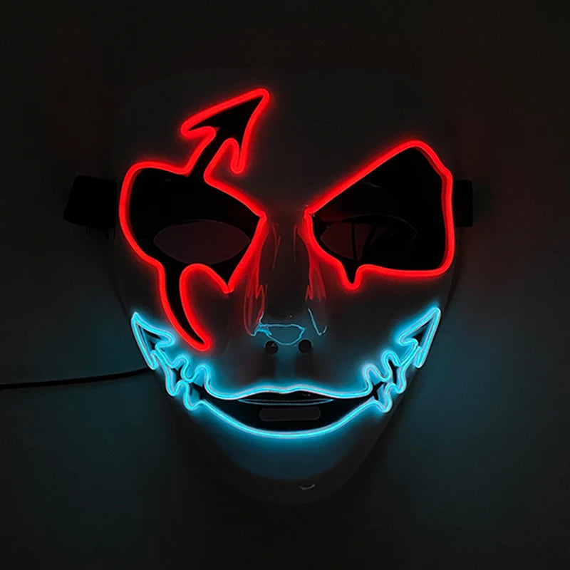 A Halloween mask with glowing red neon devil horns and eyes, and a blue neon smile, creating an eerie effect in the dark background.